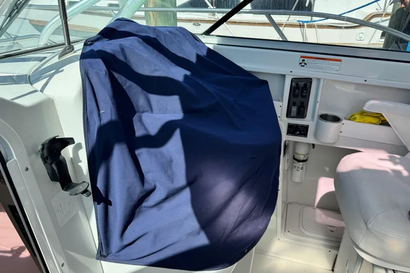 Slide: The Image of Interior of 2011 Glacier Bay 2670 Cuddy boat with covered controls and seating area. - 45