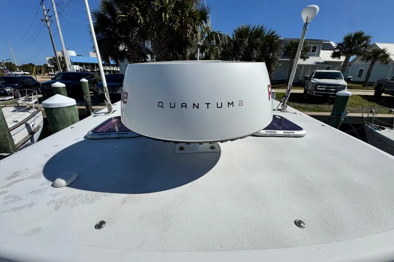 Slide: The Image of Radar system on 2011 Glacier Bay 2670 Cuddy boat, docked with palm trees in background. - 6
