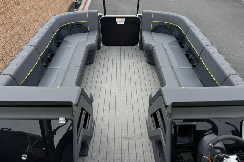 Slide: The Image of 2025 Manitou EXPLORE 24 pontoon boat interior with spacious seating and modern design. - 10