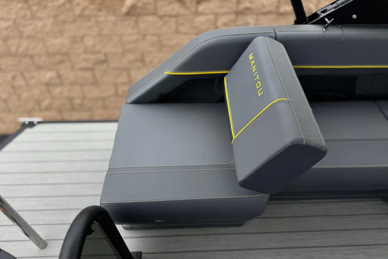 Slide: The Image of 2025 Manitou EXPLORE 24 boat seat with gray upholstery and yellow accents. - 17