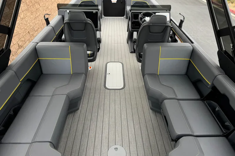 Slide: The Image of Interior of 2025 Manitou EXPLORE 24 boat with modern seating and sleek design. - 18