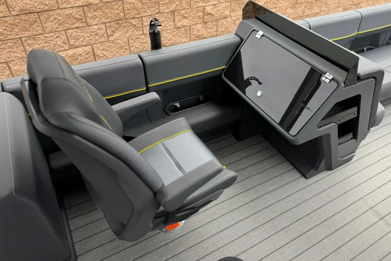 Slide: The Image of Interior of 2025 Manitou EXPLORE 24 boat with sleek seating and modern design. - 19