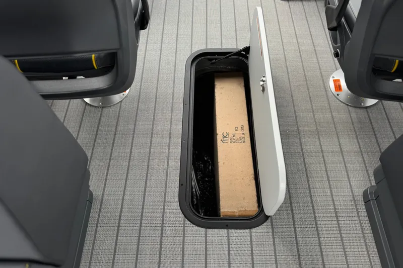 Slide: The Image of Underfloor storage compartment in 2025 Manitou EXPLORE 24 boat, showcasing practical design. - 21