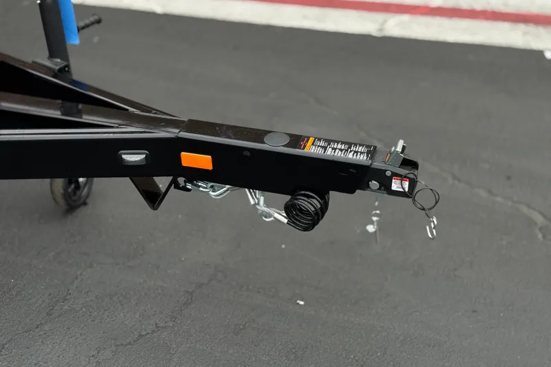 Slide: The Image of Trailer hitch of 2025 Manitou EXPLORE 24 on asphalt surface. - 25