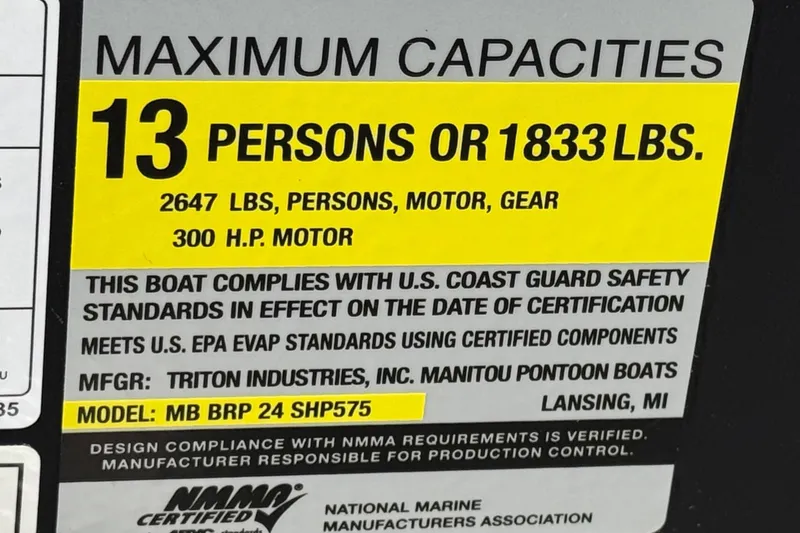 Slide: The Image of 2025 Manitou EXPLORE 24 boat capacity label: 13 persons, 1833 lbs, 300 HP motor compliance. - 26