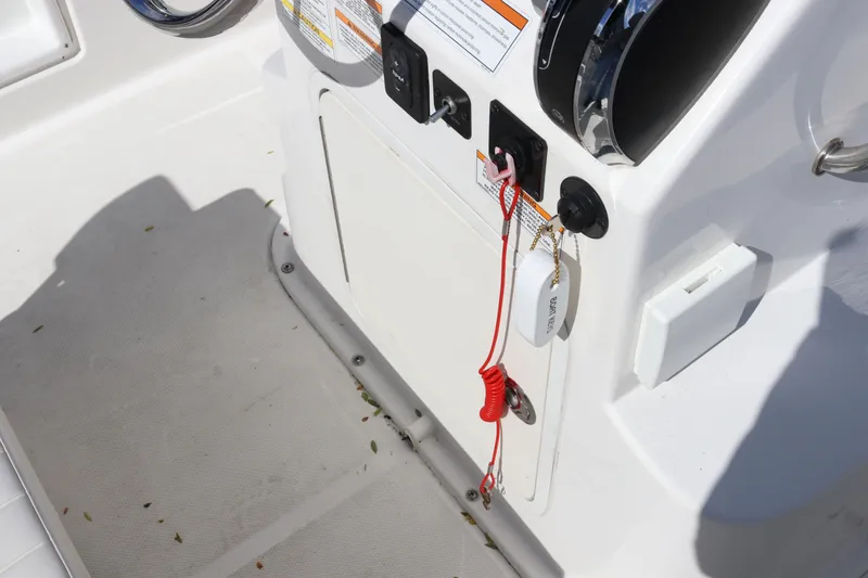 Slide: The Image of Control panel of a 2020 Bayliner Element boat with safety lanyard and switches. - 17