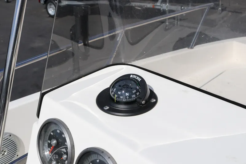Slide: The Image of 2020 Bayliner Element boat dashboard with compass and gauges. - 19