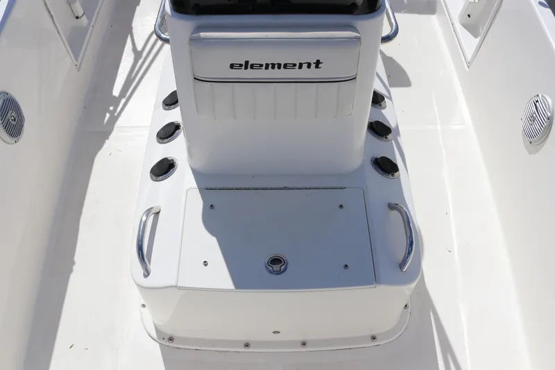 Slide: The Image of 2020 Bayliner Element boat interior with seating and storage compartments. - 21