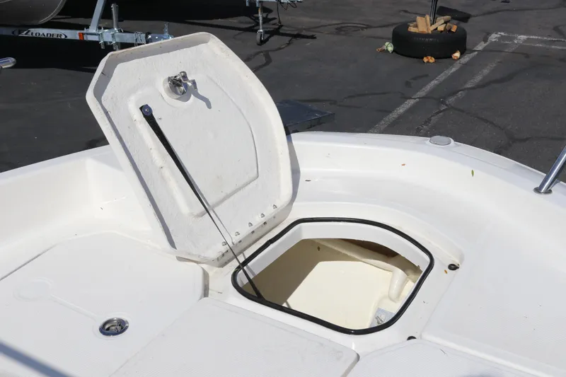 Slide: The Image of Open storage compartment on 2020 Bayliner Element boat, showing interior space. - 23