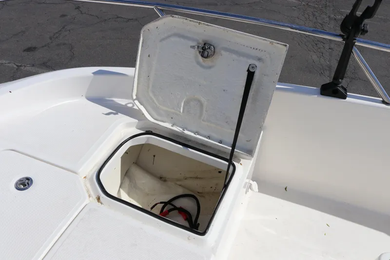 Slide: The Image of Open storage compartment on 2020 Bayliner Element boat deck. - 24