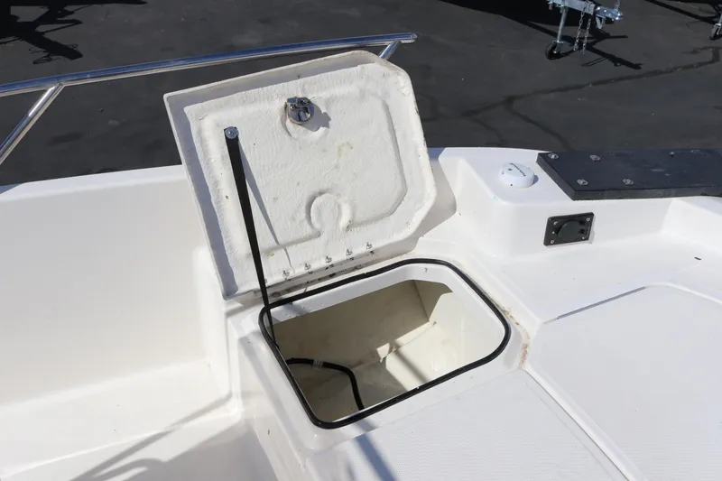 Slide: The Image of Open storage compartment on 2020 Bayliner Element boat deck. - 25