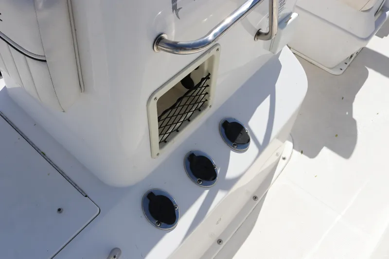 Slide: The Image of 2020 Bayliner Element boat interior with storage compartment and cup holders. - 26