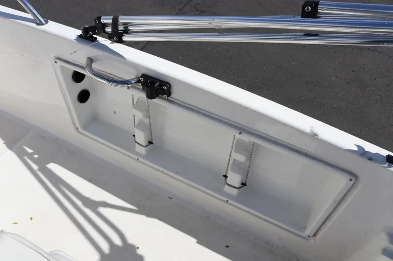 Slide: The Image of 2020 Bayliner Element boat interior with storage compartment and metal railing. - 27