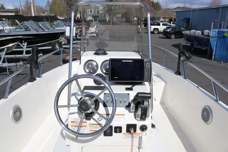 Slide: The Image of 2020 Bayliner Element boat dashboard with steering wheel and navigation system. - 28