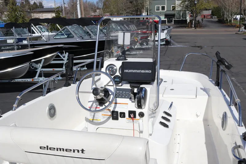 Slide: The Image of 2020 Bayliner Element boat interior with steering wheel and Humminbird navigation system. - 30