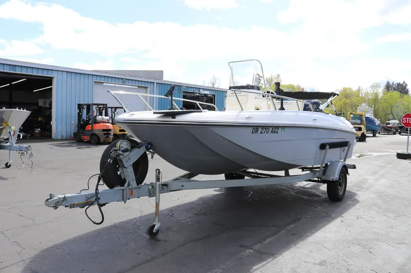 Slide: The Image of 2020 Bayliner Element boat on trailer in outdoor storage facility. - 5