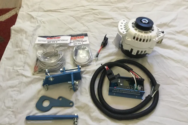 Slide: The Image of Alternator kit for 1977 Gulfstar 37, including cables, brackets, and regulator. - 17