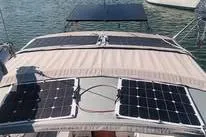 Slide: The Image of 1977 Gulfstar 37 sailboat with solar panels on deck, docked in a marina. - 4