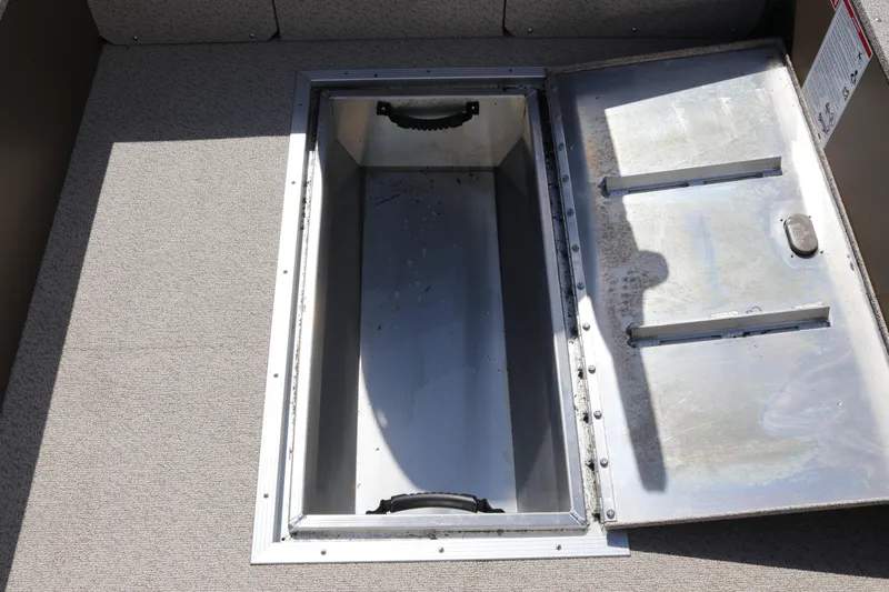 Slide: The Image of Open storage compartment on 2026 Smoker Craft Freedom 160 TL boat. - 12