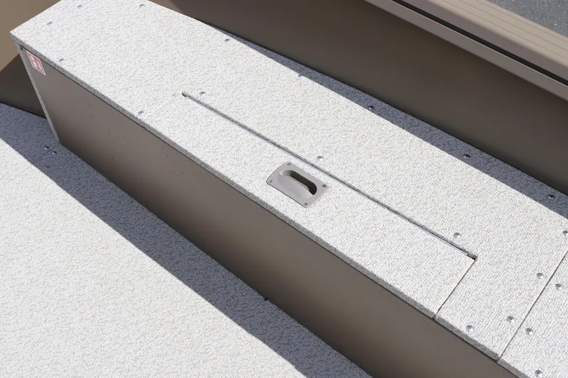 Slide: The Image of 2026 Smoker Craft Freedom 160 TL boat storage compartment with textured surface and handle. - 16