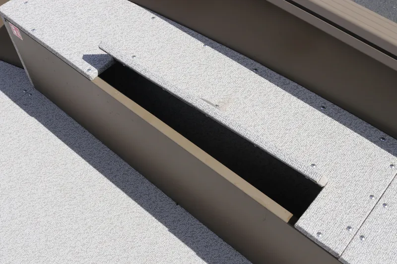 Slide: The Image of Storage compartment on 2026 Smoker Craft Freedom 160 TL boat, featuring textured surface. - 17