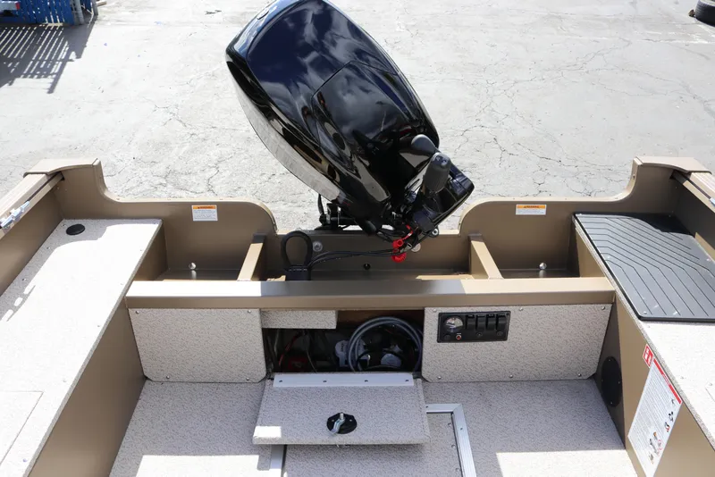 Slide: The Image of 2026 Smoker Craft Freedom 160 TL boat interior with motor and control panel. - 18