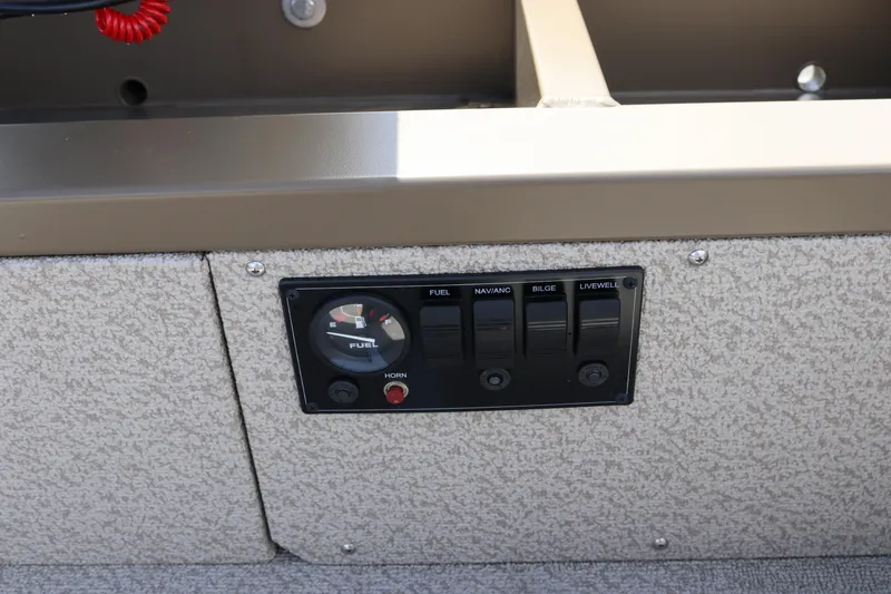 Slide: The Image of Control panel of 2026 Smoker Craft Freedom 160 TL boat with fuel gauge and switches. - 19