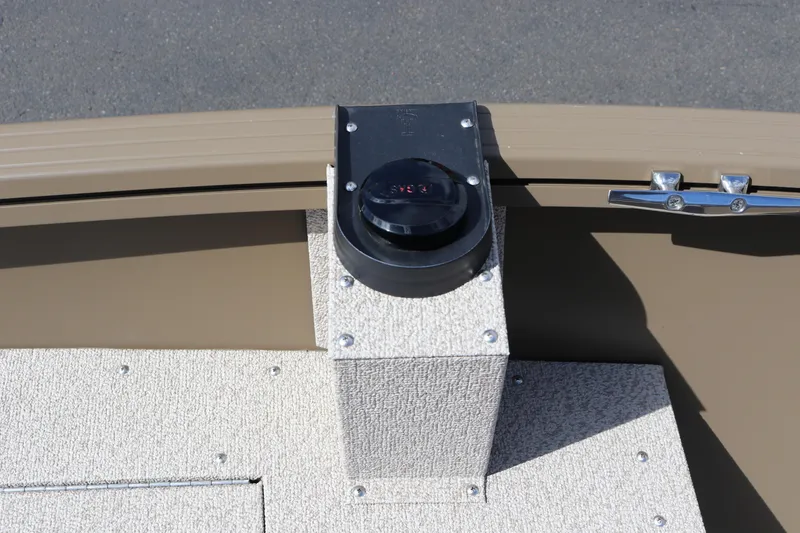 Slide: The Image of 2026 Smoker Craft Freedom 160 TL boat detail with compass and textured flooring. - 22