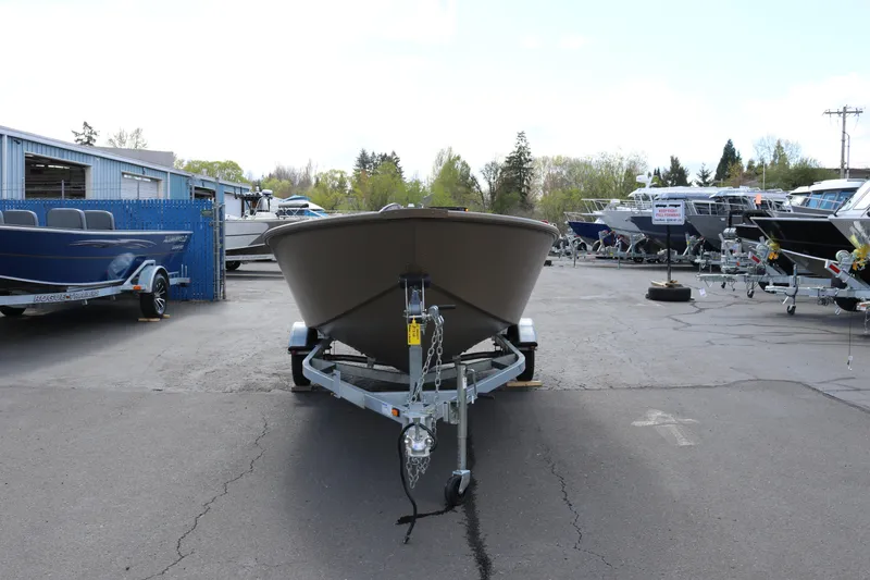 Slide: The Image of 2026 Smoker Craft Freedom 160 TL boat on trailer in outdoor dealership lot. - 3