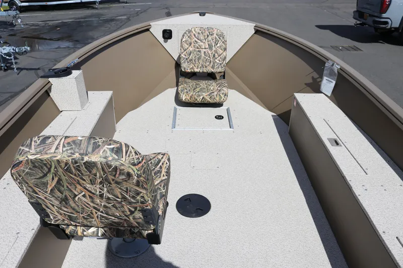 Slide: The Image of 2026 Smoker Craft Freedom 160 TL boat interior with camo seats and spacious layout. - 7