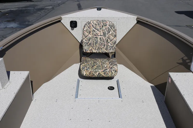 Slide: The Image of 2026 Smoker Craft Freedom 160 TL boat interior with camo seat and storage compartment. - 8