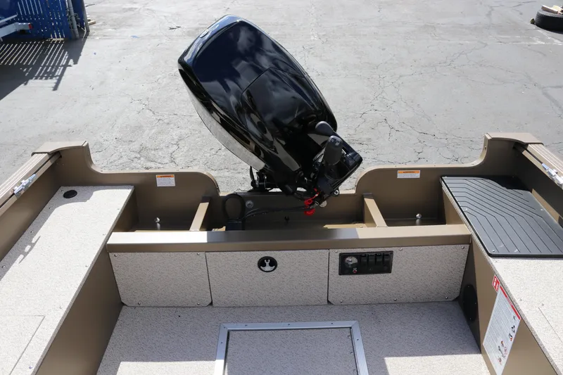 Slide: The Image of 2026 Smoker Craft Freedom 160 TL boat with outboard motor, rear view. - 9