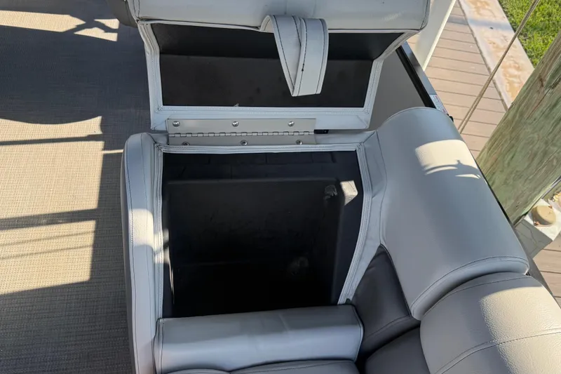 Slide: The Image of Open storage compartment in 2021 Bentley Pontoons 220/223 Elite Admiral boat seat. - 13