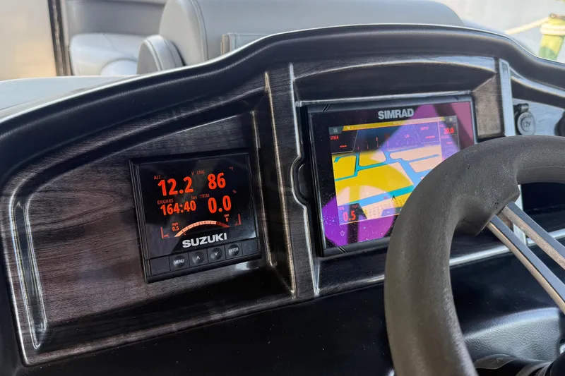 Slide: The Image of Dashboard of 2021 Bentley Pontoons 220/223 Elite Admiral with Suzuki and Simrad displays. - 14