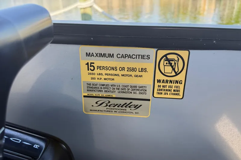 Slide: The Image of 2021 Bentley Pontoons 220/223 Elite Admiral capacity label, 15 persons or 2580 lbs, ethanol warning. - 18