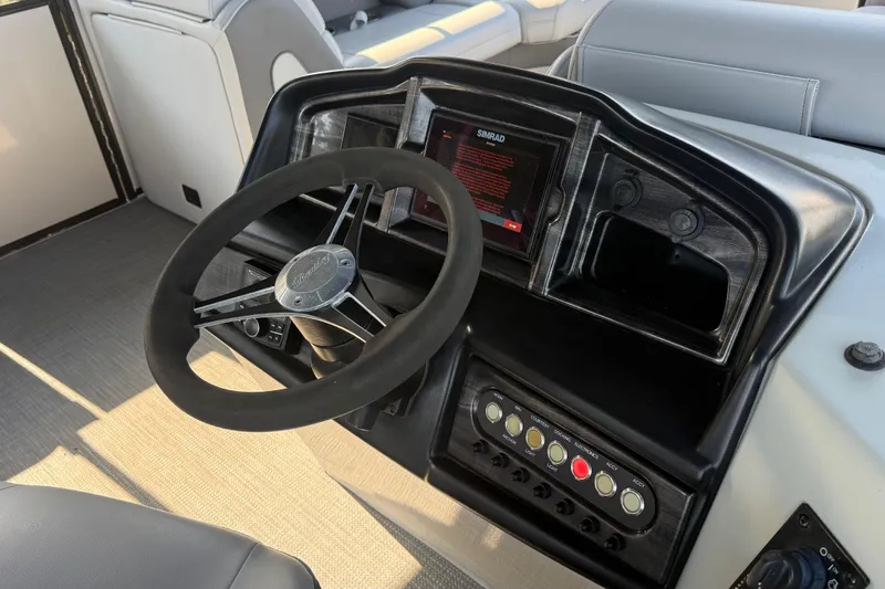 Slide: The Image of 2021 Bentley Pontoons 220/223 Elite Admiral dashboard with steering wheel and control panel. - 8
