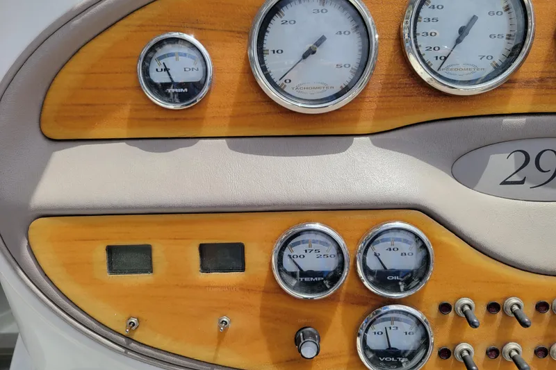 Slide: The Image of Dashboard of a 2002 Cobalt 293 boat with gauges and switches. - 15