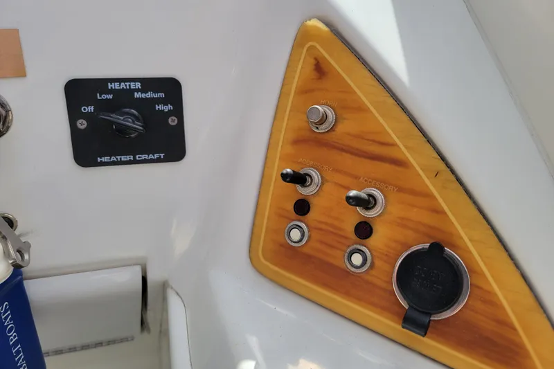 Slide: The Image of Control panel of a 2002 Cobalt 293 boat with heater and accessory switches. - 17