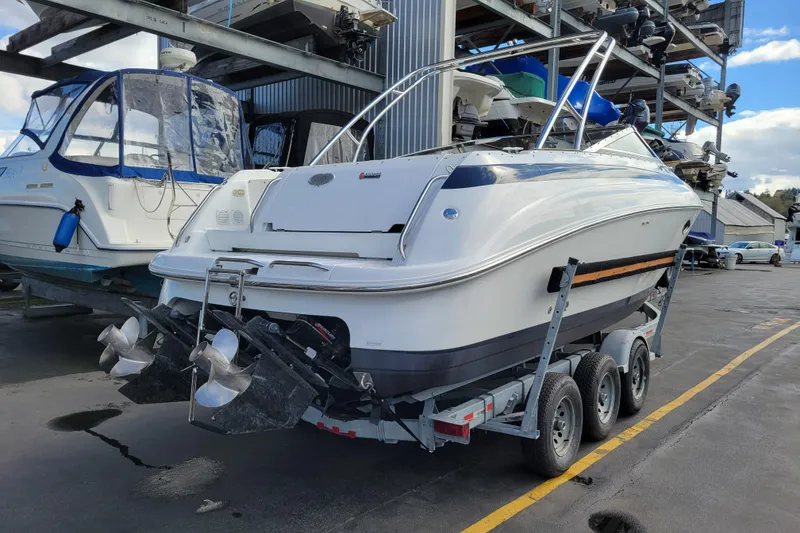Slide: The Image of 2002 Cobalt 293 boat on trailer in marina storage area. - 2