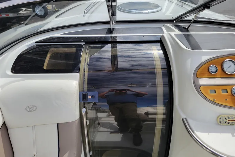 Slide: The Image of 2002 Cobalt 293 boat interior with dashboard and sliding door. - 20