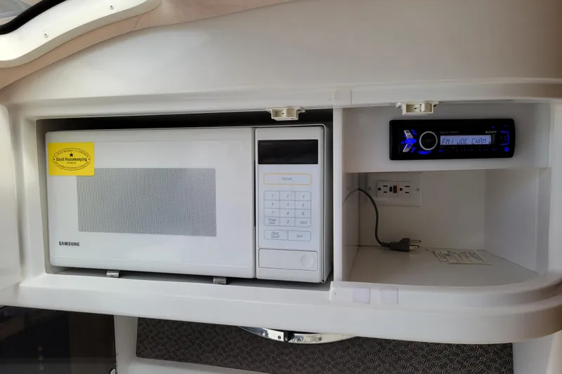 Slide: The Image of 2002 Cobalt 293 interior with Samsung microwave and Sony stereo system. - 23