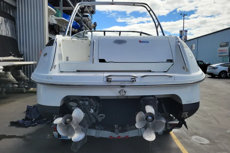Slide: The Image of Rear view of a 2002 Cobalt 293 boat with dual propellers in a marina. - 3