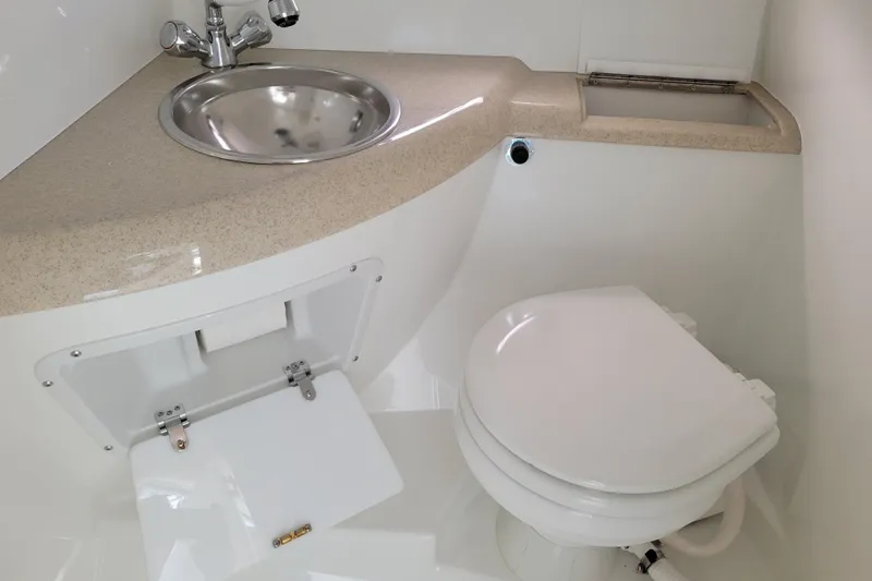 Slide: The Image of Compact boat bathroom with sink and toilet, Cobalt 293, 2002 model. - 31
