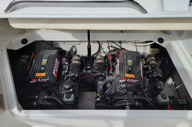 Slide: The Image of Twin Mercury 5.0L engines in a 2002 Cobalt 293 boat engine compartment. - 43