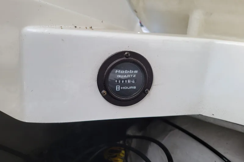 Slide: The Image of Hobbs Quartz hour meter on a 2002 Cobalt 293 boat dashboard. - 45