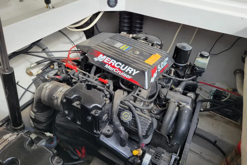 Slide: The Image of Engine compartment of a 2002 Cobalt 293 boat featuring a Mercury MerCruiser 5.0L EFI engine. - 46