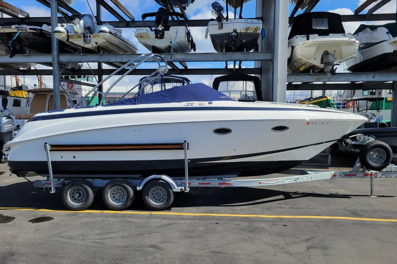 Slide: The Image of 2002 Cobalt 293 boat on trailer in marina storage, side view. - 50