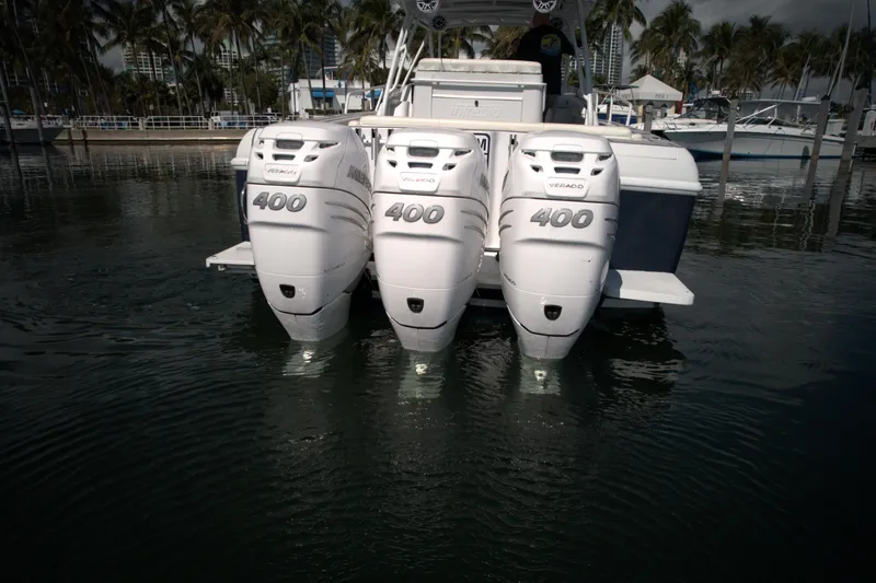 Slide: The Image of 2002 Intrepid 377 Walkaround Cuddy with triple 400 horsepower outboard engines. - 17