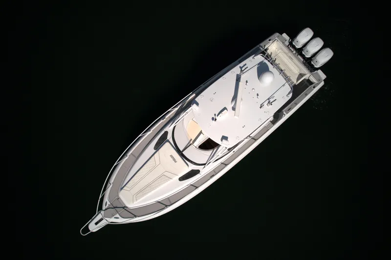 Slide: The Image of Top view of a 2002 Intrepid 377 Walkaround Cuddy boat with triple outboard engines. - 23