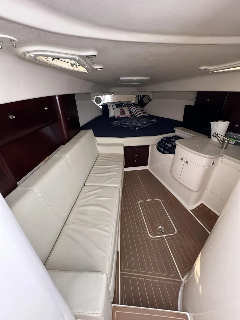 Slide: The Image of 2002 Intrepid 377 Walkaround Cuddy interior with seating and sleeping area. - 37